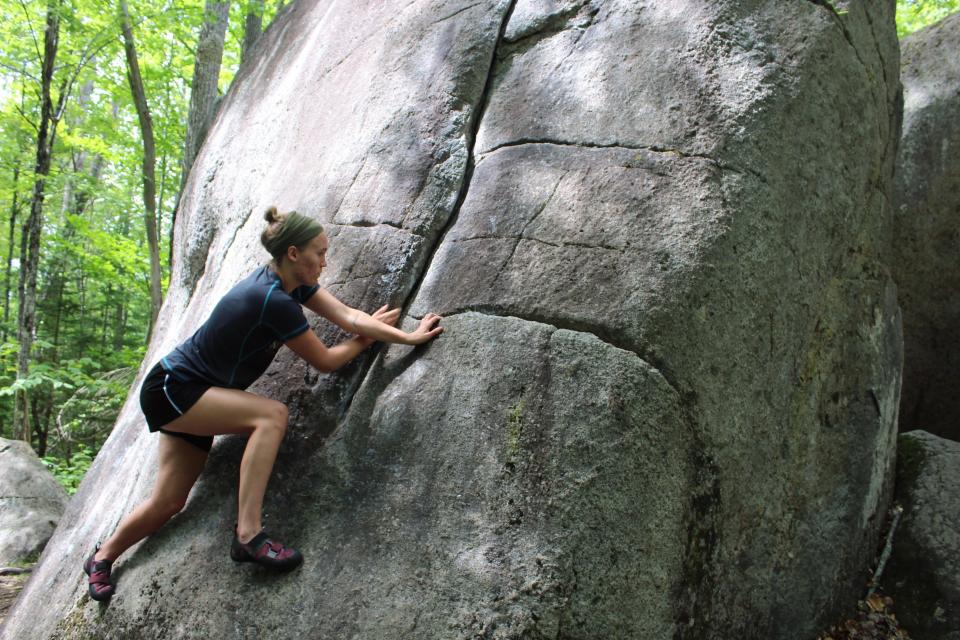 A climber moves up a classic slab