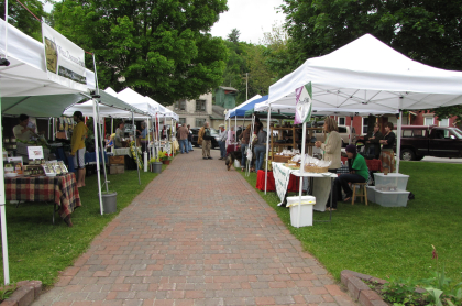 A line of tents at the Farmer's Market in Riverside Park