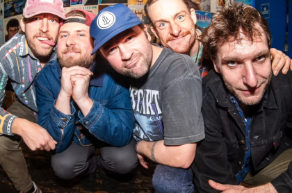 5 annie and the water band members looking directly at the camera