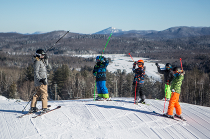 A few people at the top of Mt Pisgah ready to ski down