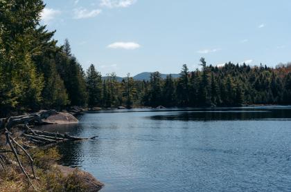 A view over a small pond of the distance mountains