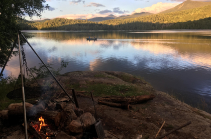 A campfire by the water