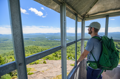 A hiker standing in the St Regis firetower