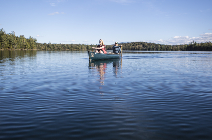 A couple people in a canoe