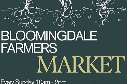 blue poster with white outline/image of vegetables growing in the ground 