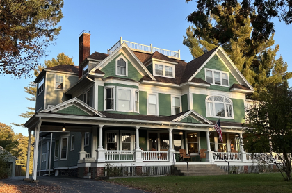 Exterior of the Franklin Manor with elaborate white trim