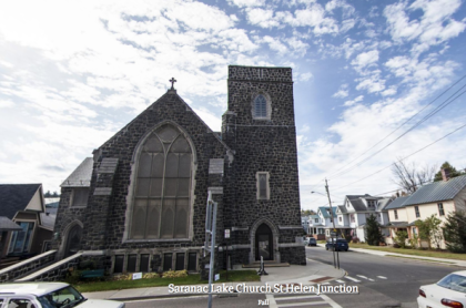 Exterior of the tall grey stone church