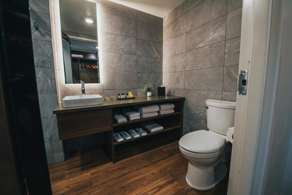 The bathroom of a hotel room at Saranac Waterfront Lodge