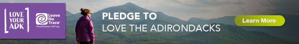 Love Your ADK banner with mountains and a "learn more" button
