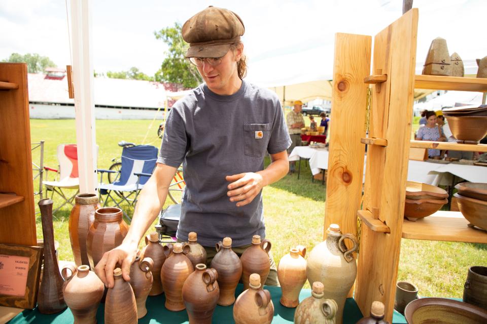 man sells vases that he has made