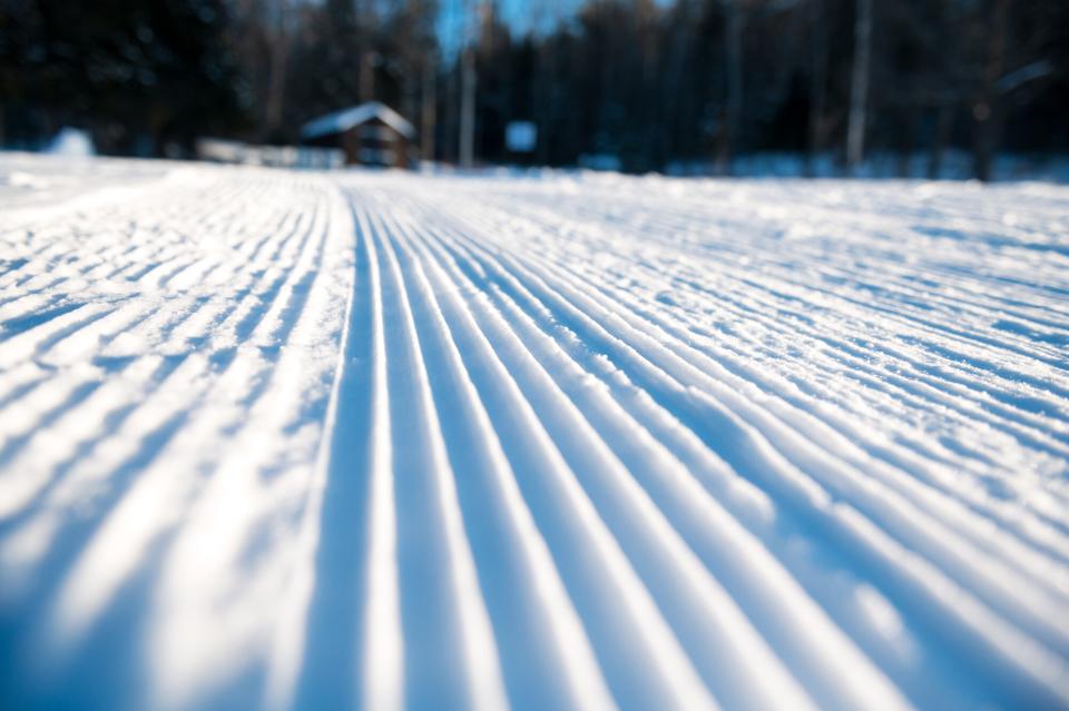 The perfectly groomed corduroy at a ski center.