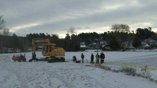 construction begins at daybreak, with heavy equipment (on land) and hand tools (on ice)