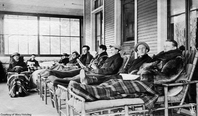 this early photo of patients curing show them in cure chairs that had not yet fully evolved; no wheels and the mattresses were not supported by the wire coils of later versions