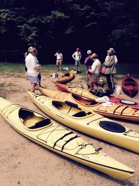 A group of kayakers preparing to embark on an Adirondack kayak trip along what is sure to be their new favorite kayak route.