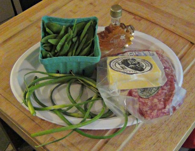 sugar snap peas, maple syrup, ground pork, farmer's cheese, and some unknown green things (garlic scapes)