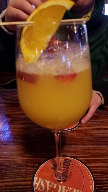 A traditional mimosa with fresh berries