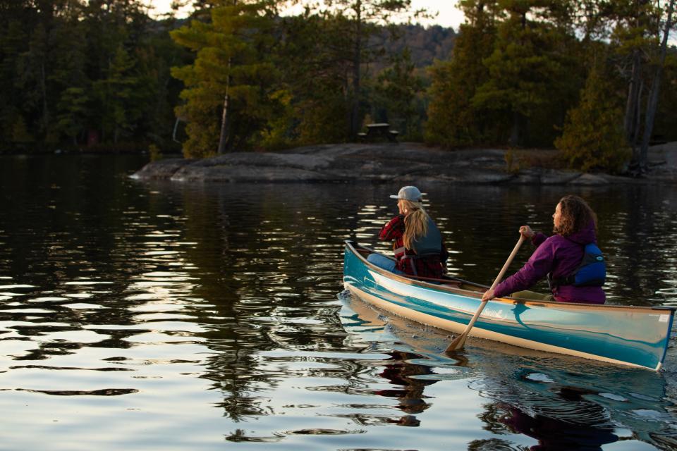 Two women paddling.