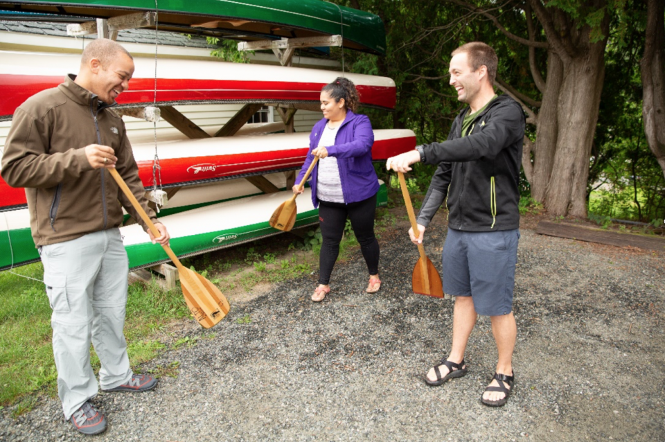 Tyler (right), teaching us proper technique and showing us our canoes for the day.