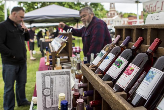 A display of wines for sale at the outdoor Saranac Lake farmers market.