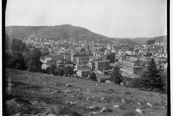 Black and white image, circa 1909, of Saranac Lake from Blood Hill.