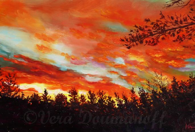 A vibrant red and orange sunset painted with oil paints.