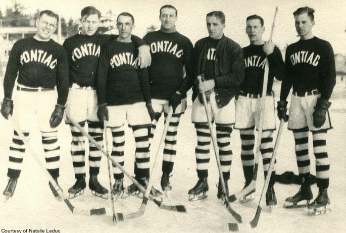 Saranac Lake Boys' Club Pontiac ice hockey team, c. 1924: Lyall Delamater, unknown, unknown, Louis Miron, Bill LaPan, Doug Bombard.  Photo courtesy of Saranac Lake Historical Society.