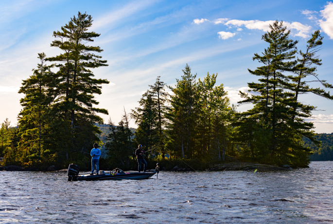 Scenic photo of people in a fishing boat.