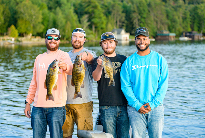 4 men showing off their catch