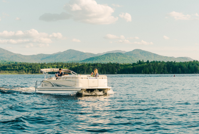 A family on a boat near Saranac Lake