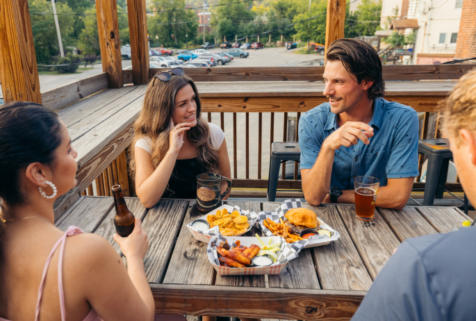 People eating dinner on the patio of Grizle T's