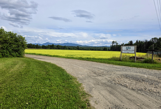 Farmhouse UTV signage and fields.