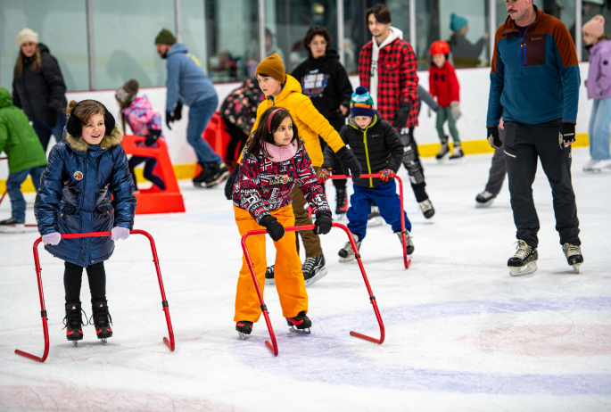 Kids skating at a civic center