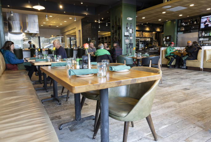 tables at restaurant with  a few dinners in teh background
