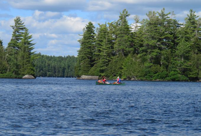 People paddling to their campsite on Lower Saranac Lake