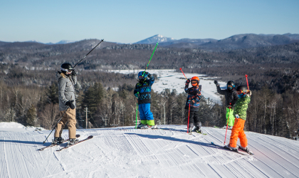 A few people at the top of Mt Pisgah ready to ski down
