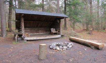 A lean-to with a firepit