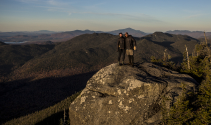 Two people on the summit of Seymour