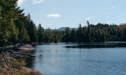 A view over a small pond of the distance mountains