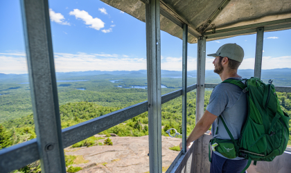 A hiker standing in the St Regis firetower