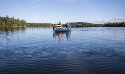 A couple people in a canoe