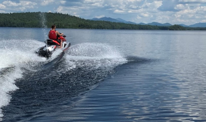 A jet skier rides through the water.