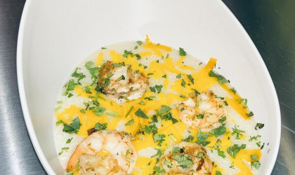 Camarones Y Grits at Our Plates - Creamy grits topped with seasoned shrimp