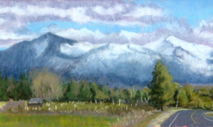 A pastel creation of a meadow and mountains.