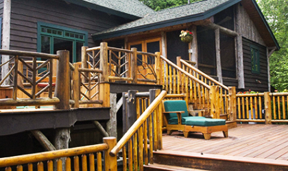A brown cabin with large decks